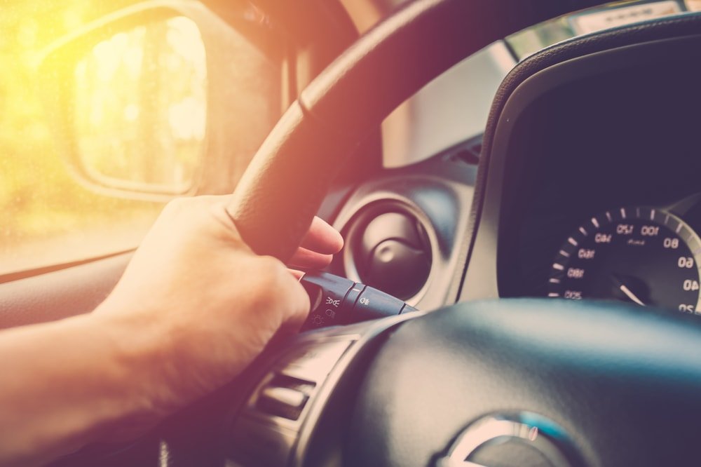 Car making left hand turning signal.