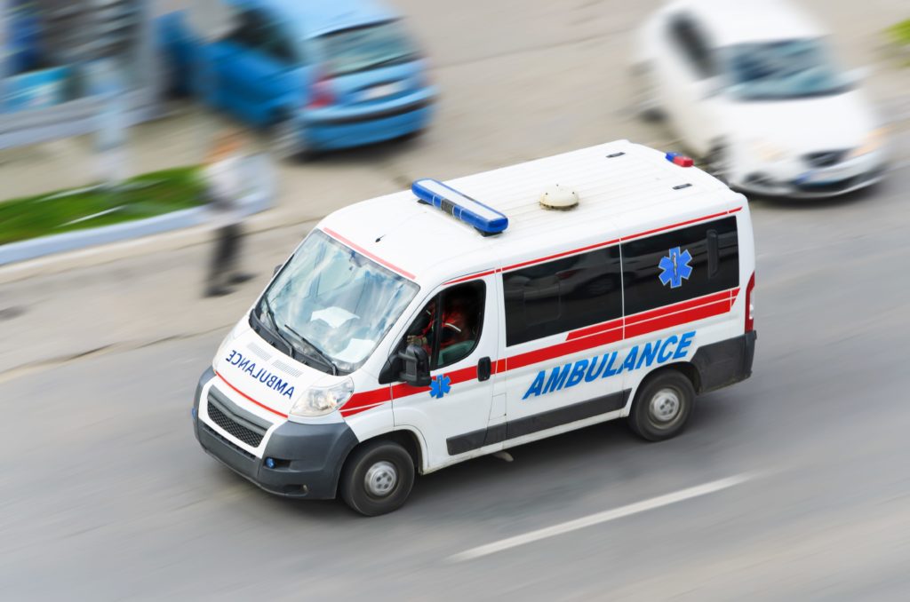 Ambulance passing the highway.