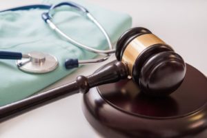 Personal injury law concept showing stethoscope and gavel in Glendale.