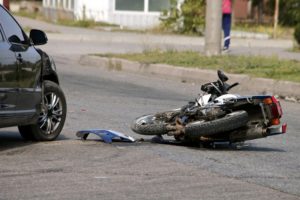 Motorcycle accident in the middle of the road.