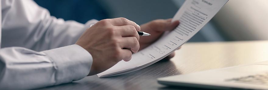 A Sun City business lawyer looks over some paperwork in his Arizona office.