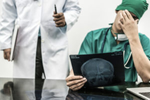 doctor being informed of a medical error
