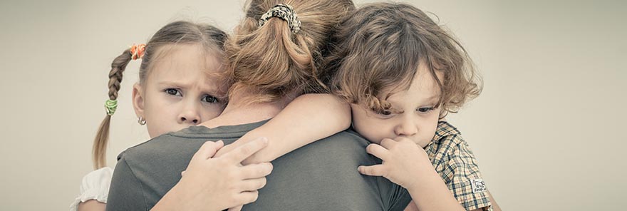 children hugging mom