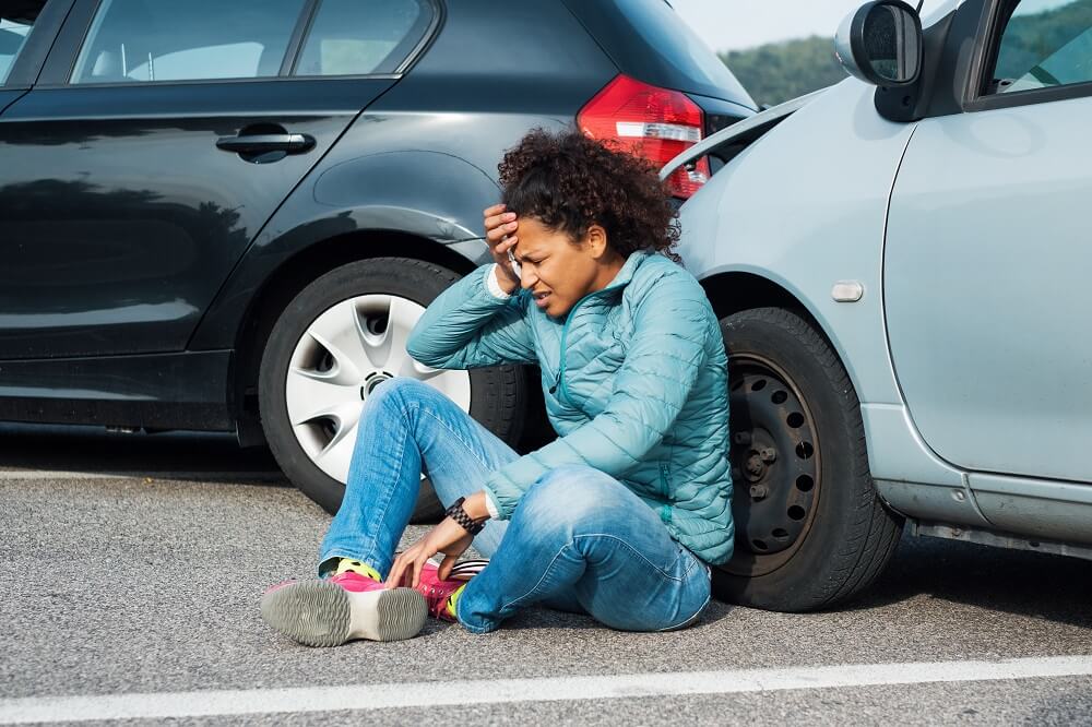 Woman driver tailgating the car in front causing accident.