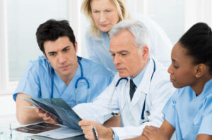 Team of medical professionals holding a meeting.