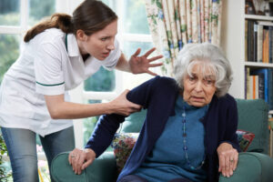 Caregiver abusing senior in nursing home.