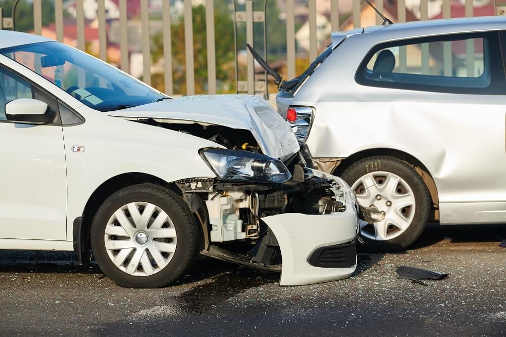 Two white cars on rear-end collision