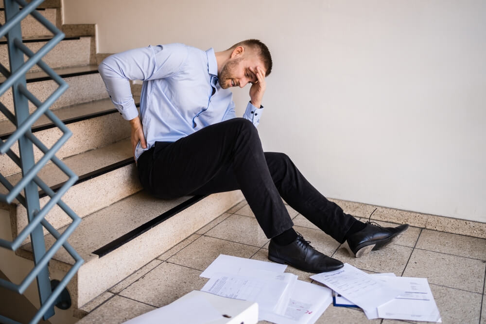 Businessman fell down the stairways