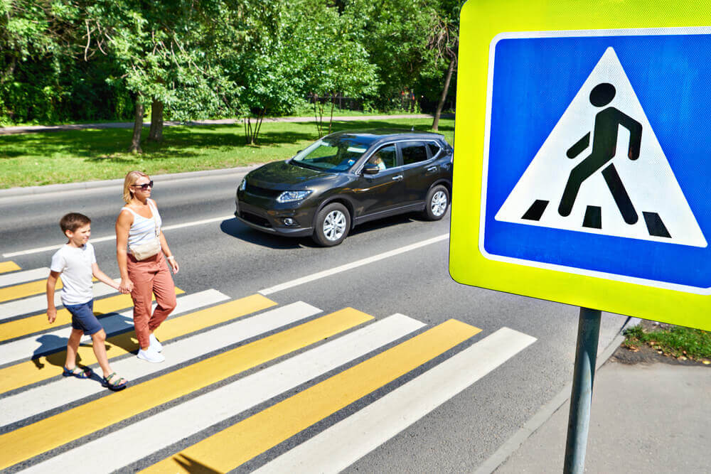 Pedestrian crossing in crosswalks.