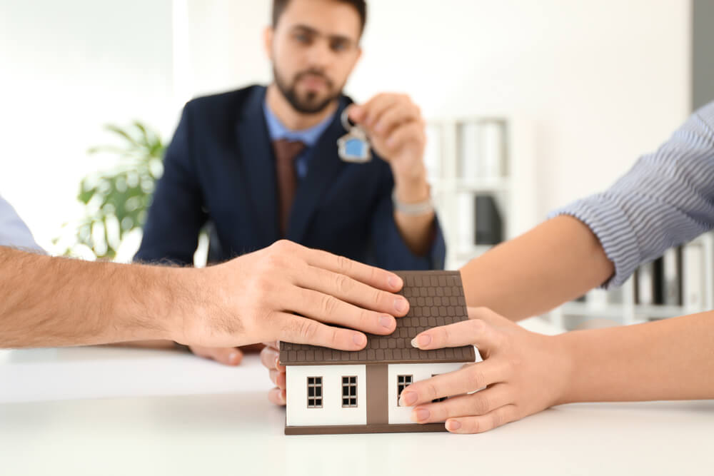 Couple in the lawyers office to divide their house.