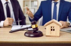 Lawyer and client make agreement of house mortgage during negotiations in office.