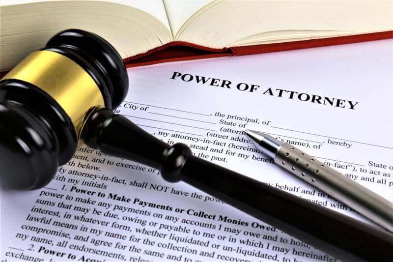 Document of power of attorney with gavel on the side.