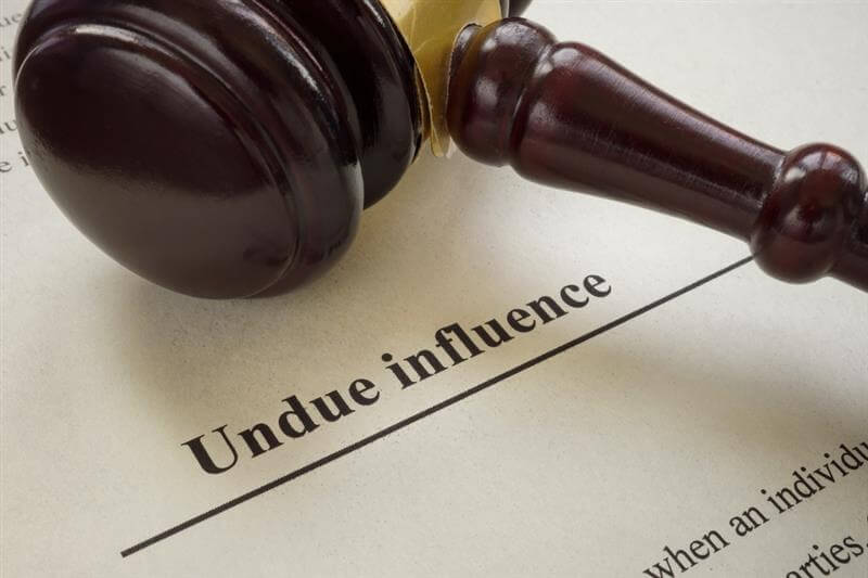 Undue influence document with gavel on the side.