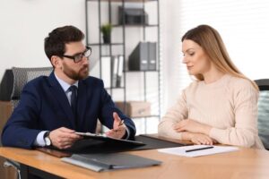 Divorcee woman meeting with her divorce lawyer at the office.