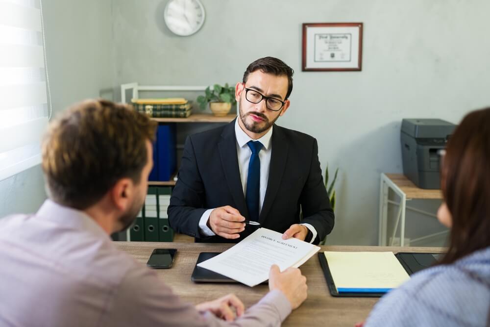 Couple consulting family lawyer.