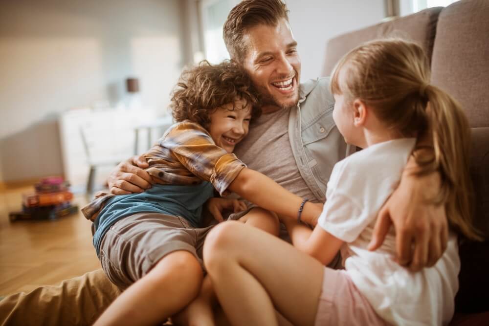 Happy father seeing his kids after separation.